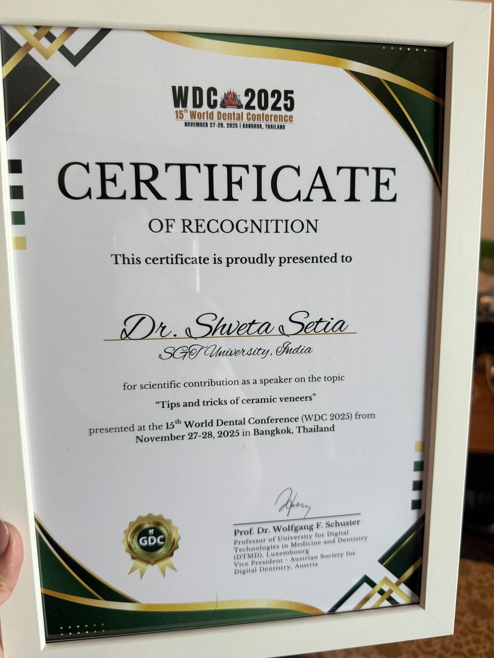 Certificate of recognition from the 15th World Dental Conference for a talk on ceramic veneers