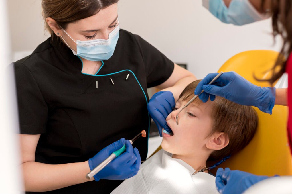 Best paediatric dentist in Gurgaon providing expert dental care to a child during a dental procedure at Artistree Dental and Cosmetic Clinic.